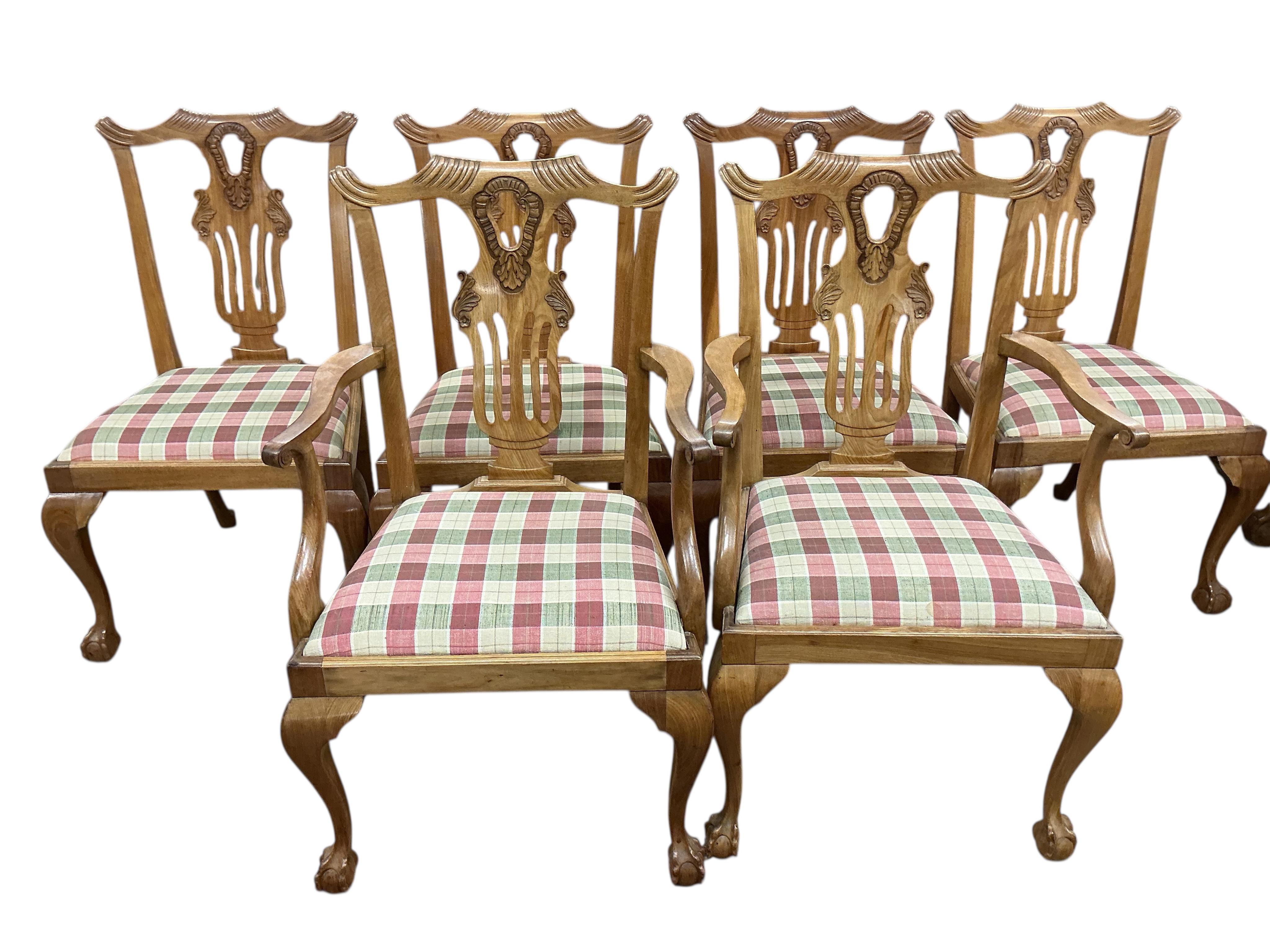 A George III style walnut extending dining table, (no leaves), 124cm, depth 104cm, height 74cm and six dining chairs, two with arms